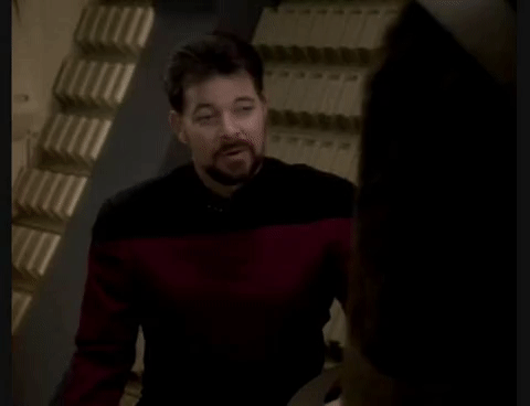 A gif of Riker from Star Trek TNG being viciously back-handed by Jean-Luc Picard in leather.